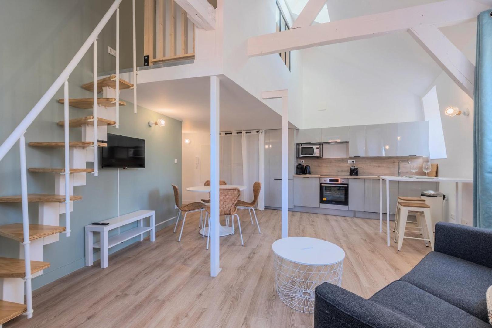 One Bedroom Mezzanine Apartment, With Parking *